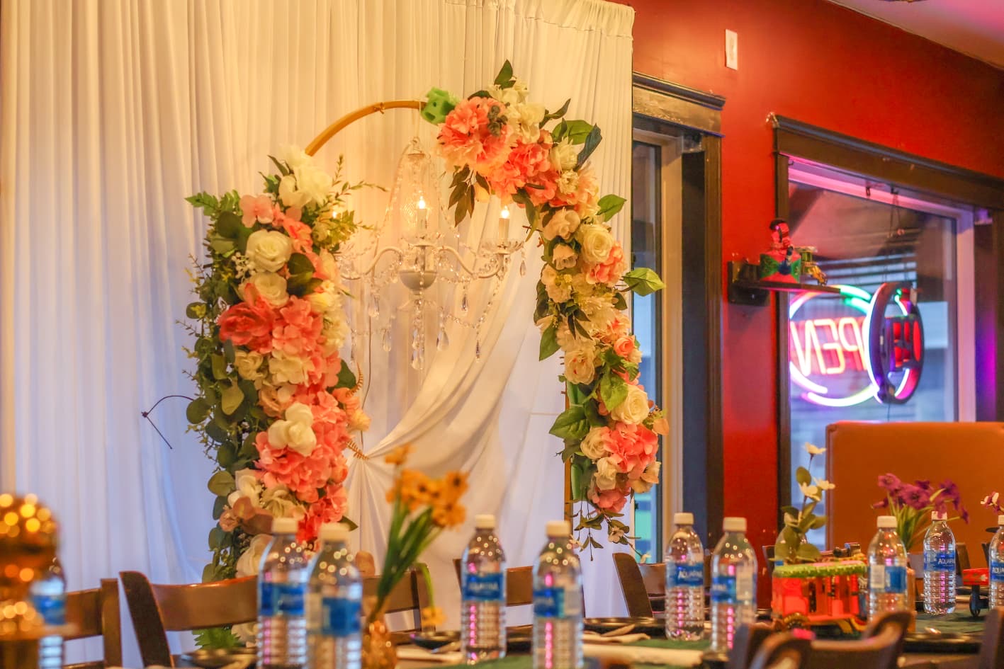 Floral arch and chandelier styling for a private dinner